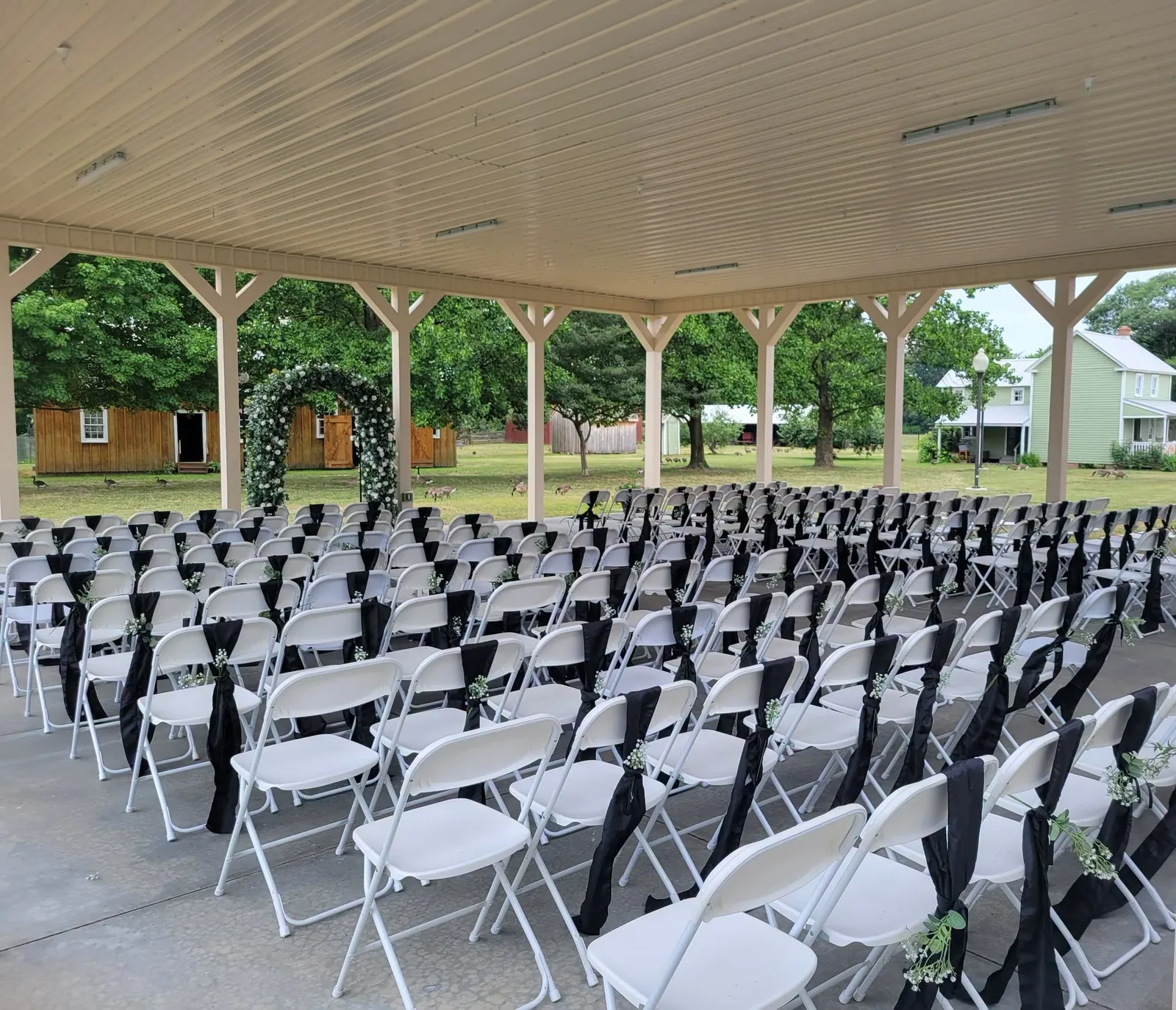 Outdoor ceremony seating beneath the pavilion at the Delaware Agricultural Museum